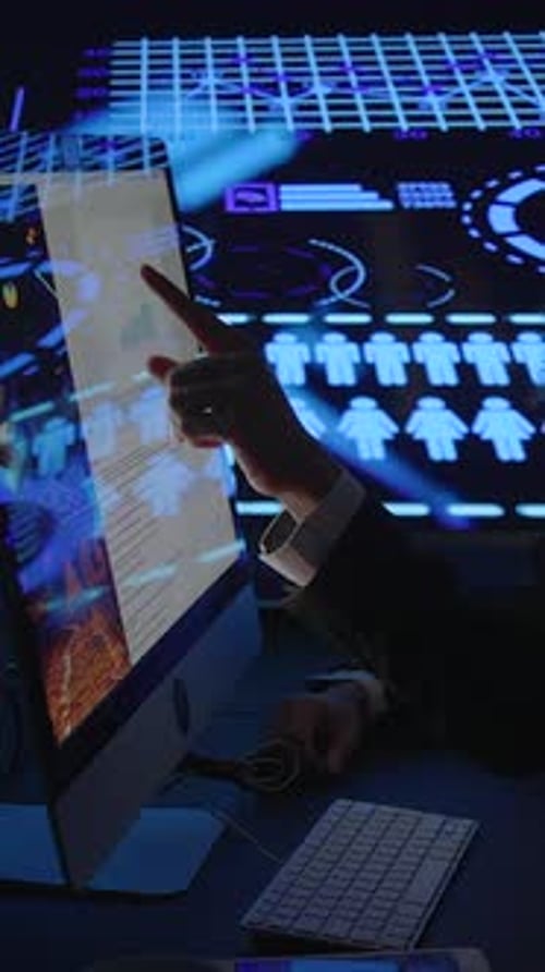 The Data Analyst is Analyzing the Graphical User Interface in a Darkened Room Setting