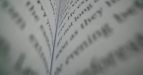 An open book very closely. Macro footage of words on page