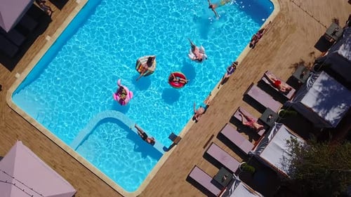 Birds Eye View of People Swimming in Pool