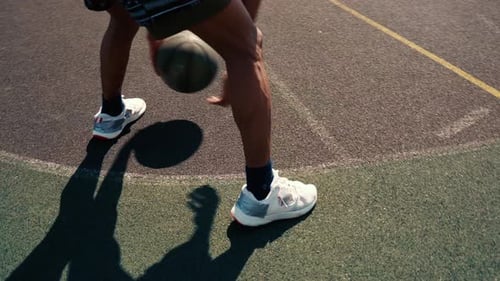 Basketball Player Dribbling Ball Outdoors