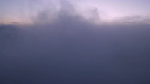 Majestic Aerial View of Dreamlike Clouds at Sunset