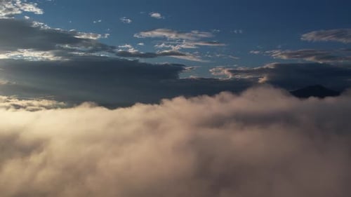 Aerial View of Golden Clouds During Sunrise
