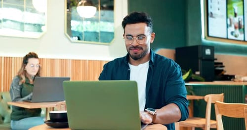 Laptop, coffee shop cafe and happy man reading online research, copywriting review