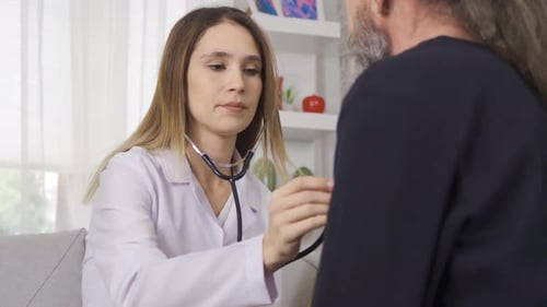 Doctor Examining Patient with Stethoscope During Checkup