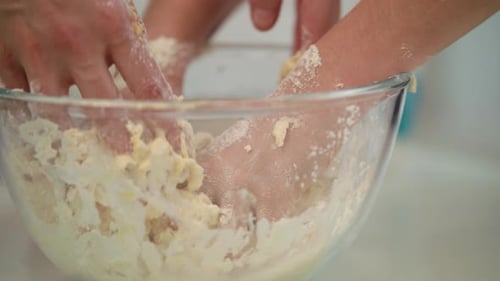 Mother With Child Cooking Dough. Closeup Shot Of Female Hands Mixing Flour In Glass Bowl. Cooking...