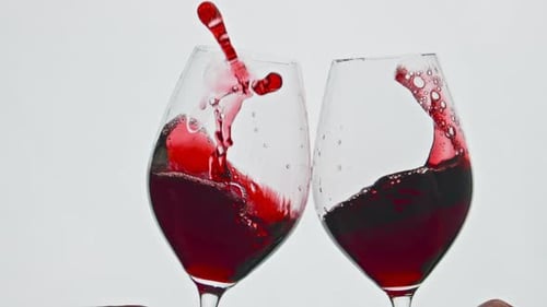 Clinking Raising Red Beverage Vessels Closeup