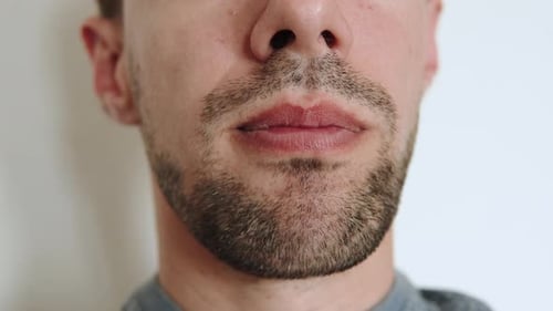 Chewing Mouth of Caucasian Man Close Up