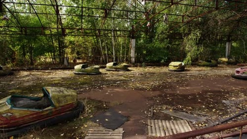 Bumper cars in amusement park of Pripyat, pan left view