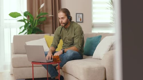 Young Adult Working at Home on Computer
