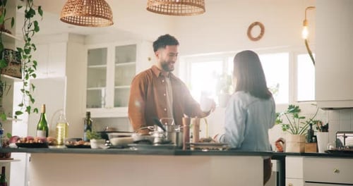 Couple in Kitchen Drinking Coffee Together