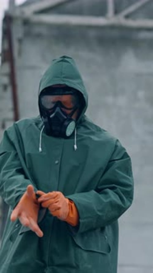 Adult with Mask Rubs Hands