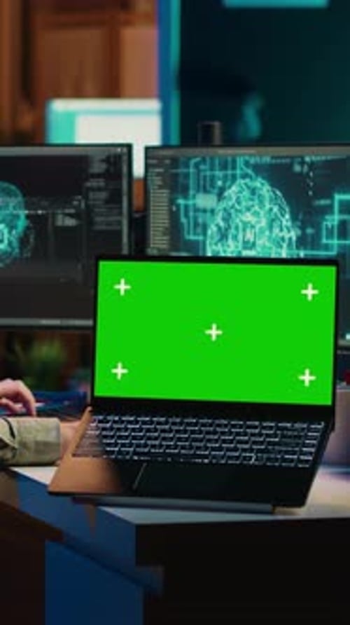 Vertical Video Engineer with EEG Headset on Merging with AI Green Screen Laptop