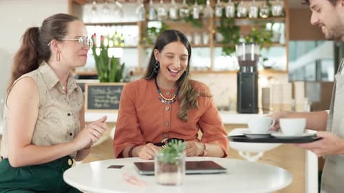 Friends at cafe, waiter with coffee and relax together, happy people and thanks with bonding