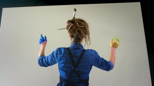 Artist Paints on Canvas with Hands