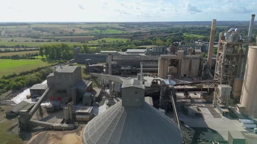 Aerial view of cement factory and chimneys, United Kingdom.