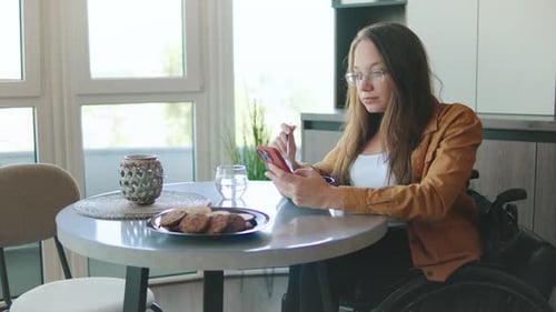 Woman Using Phone While Eating Cereal at Home