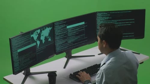 Asian Man Developer Having Headache While Write Code With Multiple Computer Screens In Green Screen