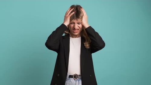 Young Adult Woman Suffering from Terrible Headache