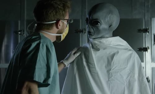 Medical Professional Examines an Alien in Examination Room