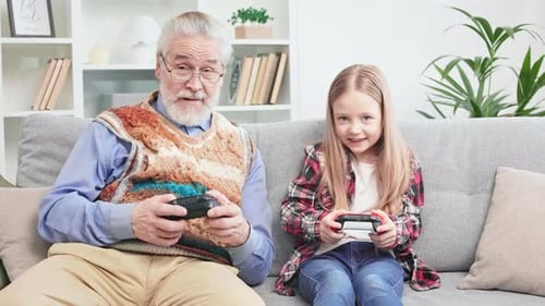 Grandparent and Child Playing Video Games Together