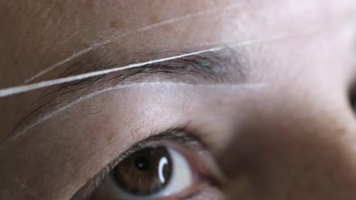 Woman's Brow Shaping with Threading Close Up