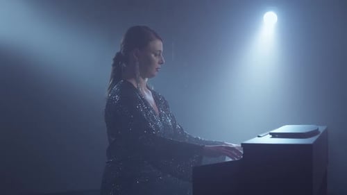 Pianist Playing Piano in Smoky Studio Young Woman in Dress Plays the Piano
