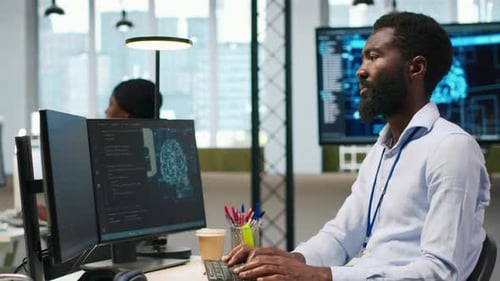 Computer Scientist Using AI on Computer to Optimize Performance