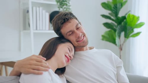 Affectionate Couple Relaxing Comfortably Together on Couch