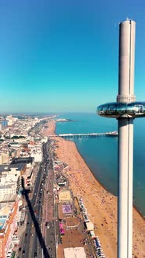 vertical drone video showing aerial approach to Brighton's famous i360 observation tower. Palace