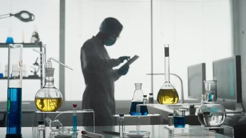 Laboratory of Modern Medical Research A Male Researcher Uses a Tablet in a Laboratory A Man Analyzes