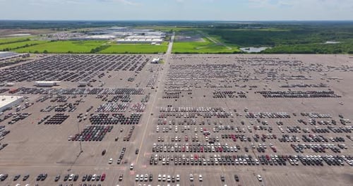 New Cars Parked for Sale on Automotive Factory Parking Lot Dealer Vehicle Inventory for Import and