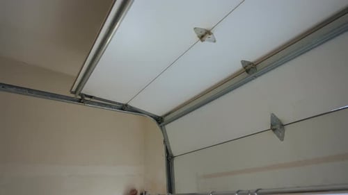 Closed Garage White Doors View From Inside in Garage