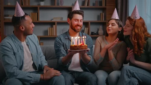 Friends Celebrate Birthday With Cake Indoors