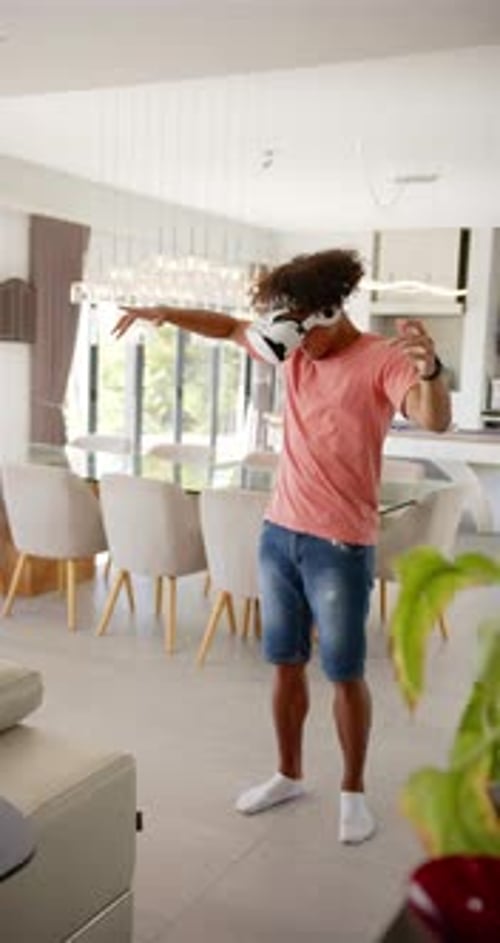 Young Adult Enjoys Virtual Reality at Home