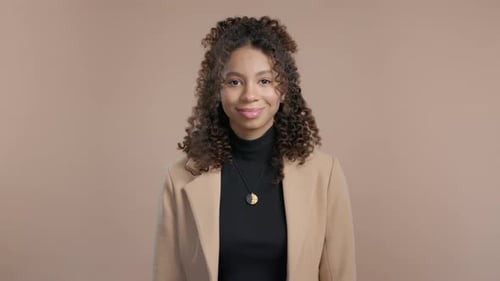 Pretty African American Young Woman Natural Beauty Teenager Girl on Beige