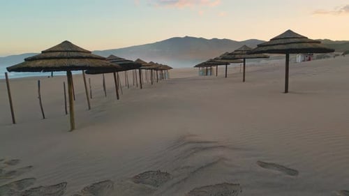 Fast Drone Flying Straw Umbrellas Beach Closeup Sunset Sandy Resort Landscape