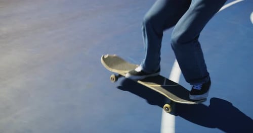 Man, skate and feet on skateboard in park, outdoor or training stunt, jump or skill in skatepark