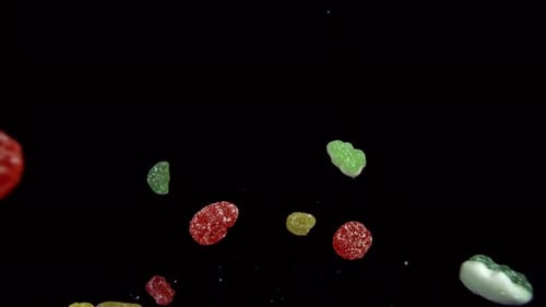 Assorted Gummy Candies Floating on Black Background