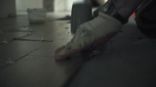 Worker Smoothing Tiles with Mallet