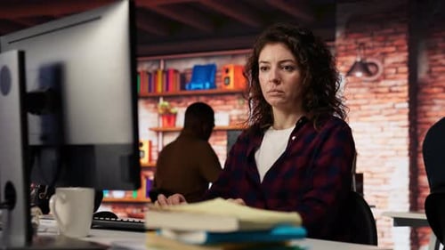 Woman Using PC in Startup Office to Design and Implement Algorithms