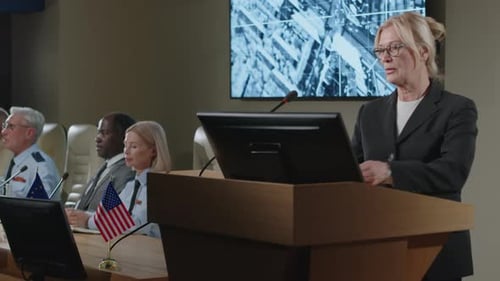 Woman Speaking at Podium at a Corporate Event