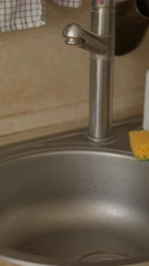 Leaking Kitchen Faucet Dripping Into Sink