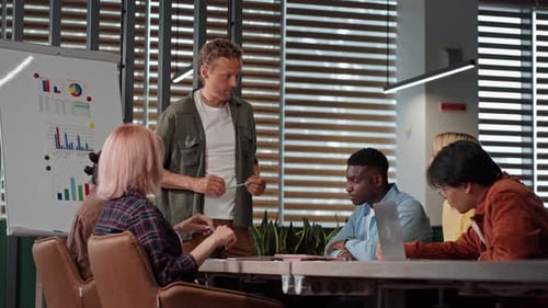 Diverse Team Collaborating During a Meeting in Modern Office