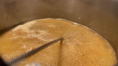 Boiling Caramel Close Up in Metal Pot