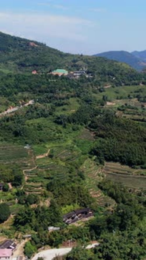 Take in the Scenic Aerial View That Showcases Lush Green Hills and Beautiful Villages Media