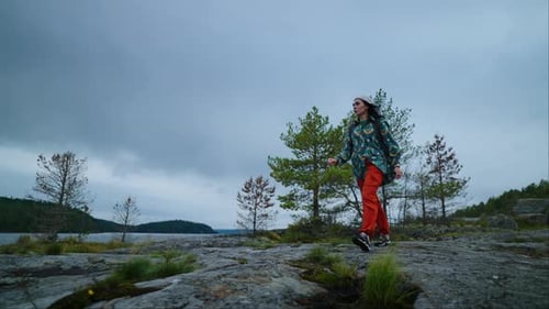 Woman Hiking with Backpack in Nature