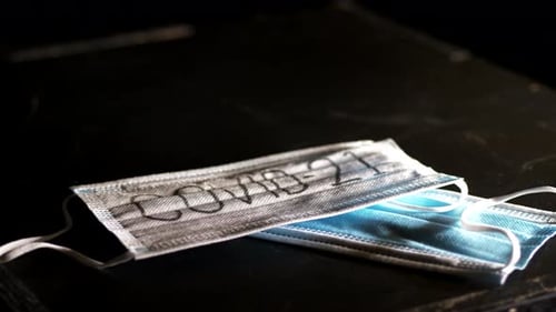 Face mask with COVID-19 sign in year 2021, year of hope