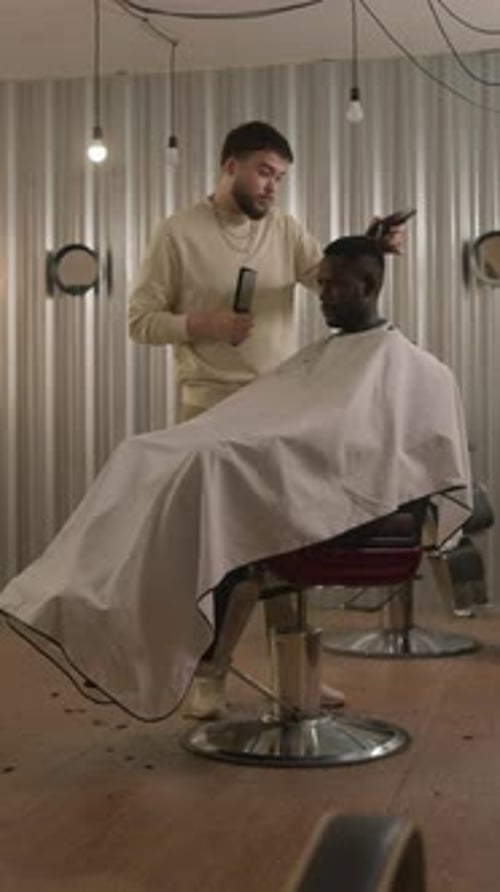 Barber Cuts Hair in Fashionable Barber Shop