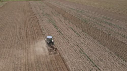 Agricultural Work with Tractor Preparing Field for Harvesting