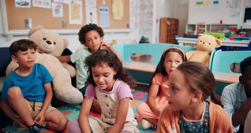 Education, talking and group of children, learning and teacher with questions in classroom